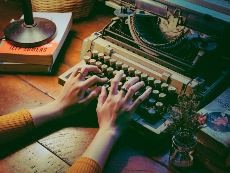 Canva - Person Using Typewriter